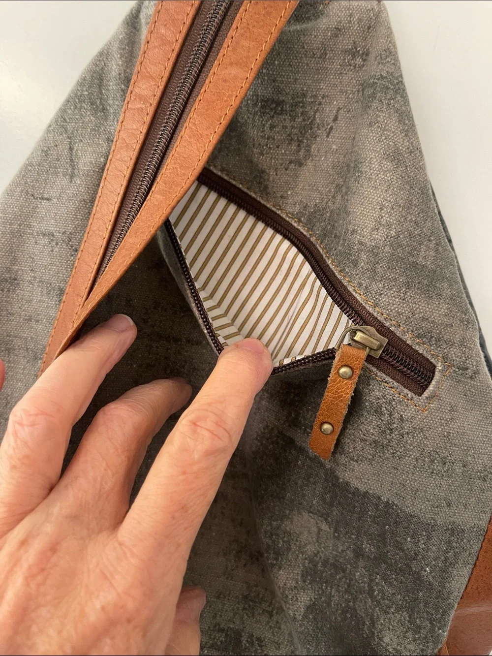 Black Leather Backpack with Brown Trim and Brass Accents